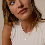 Model wearing In The Heart Of Necklace in gold