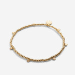 Close-up of Strength Beaded Icon Bracelet in 14k gold finish