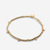 Close-up of Strength Beaded Icon Bracelet in 14k gold finish