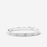 Bryan Anthonys Sea Seeker Silver Hinged Bracelet with sea shell engravings macro