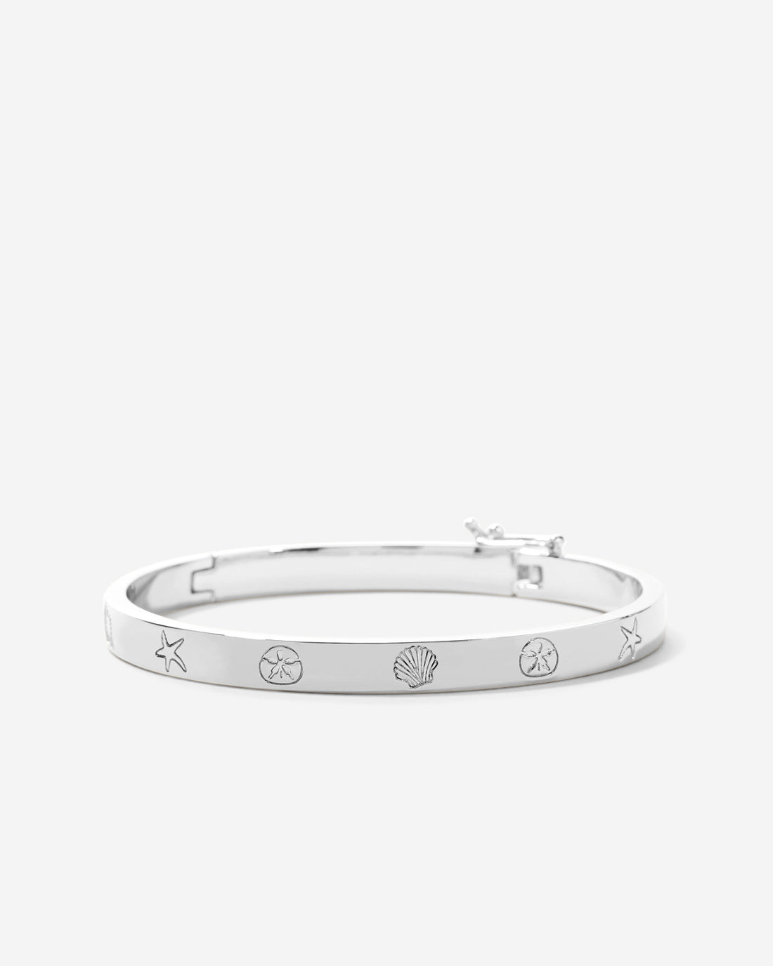 Bryan Anthonys Sea Seeker Silver Hinged Bracelet with sea shell engravings macro