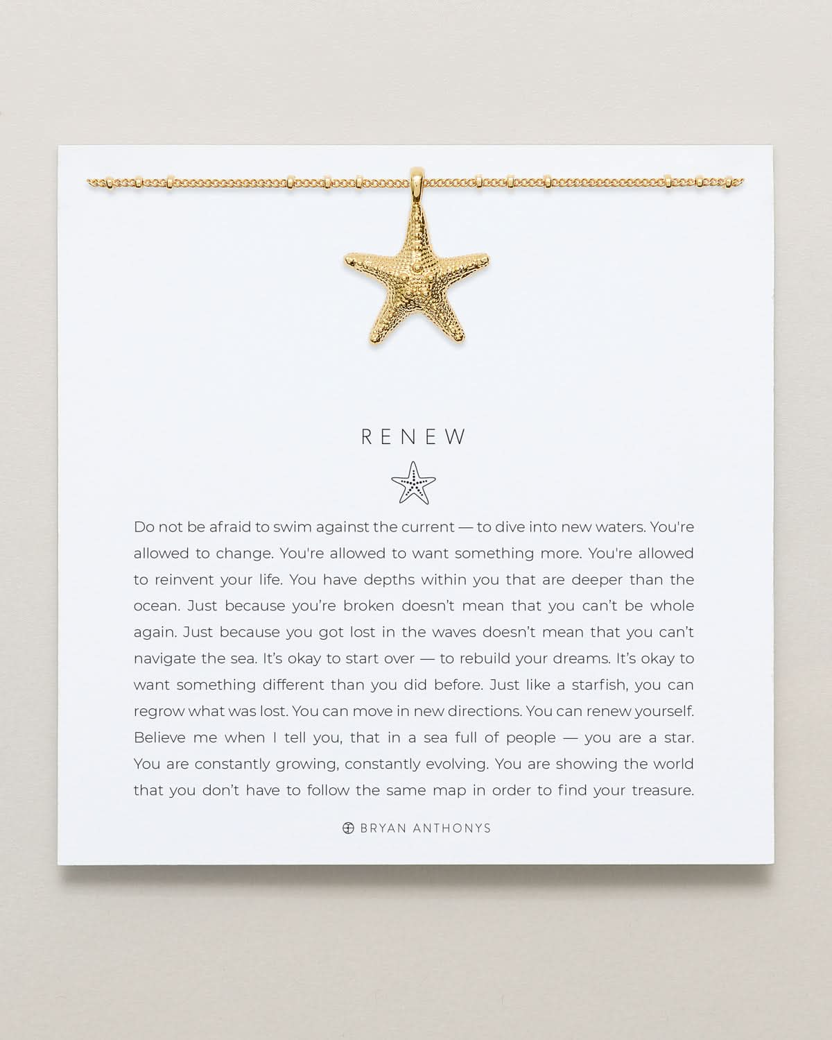 Bryan Anthonys Gold Renew Pendant Necklace On Card