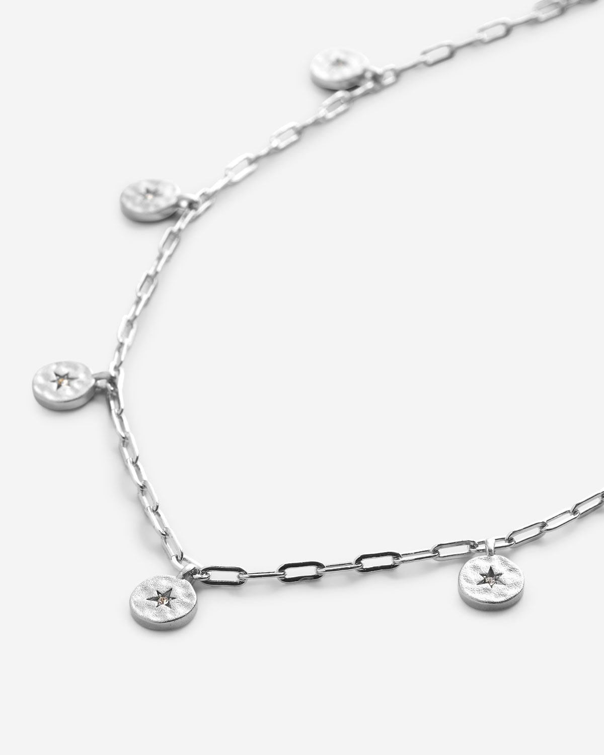 Close-up of Stars Can't Shine Without Darkness Choker in silver finish