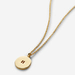 Close-up of Pause Necklace in 14k gold finish