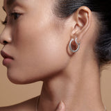Bryan Anthonys Begin Again Midi Hoop Earrings on Model in Silver