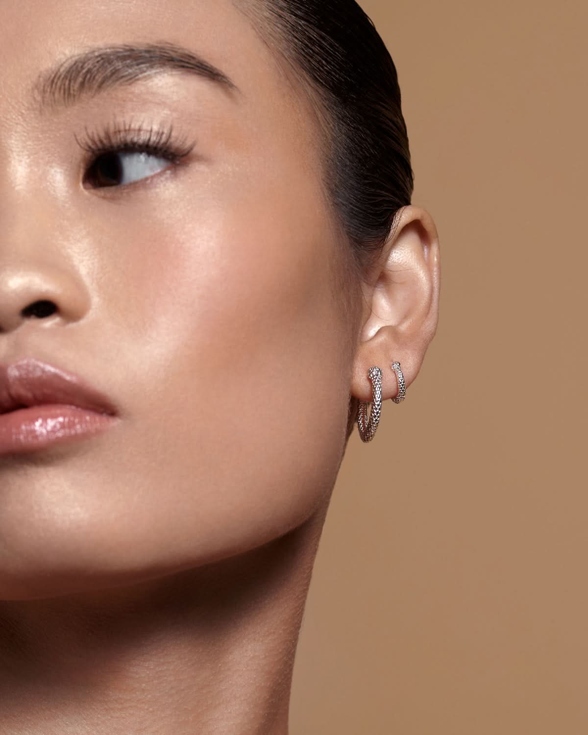 Bryan Anthonys Begin Again Mini Hoop Earrings on Model in Silver