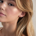 Model wearing Highs and Lows Stud Earrings