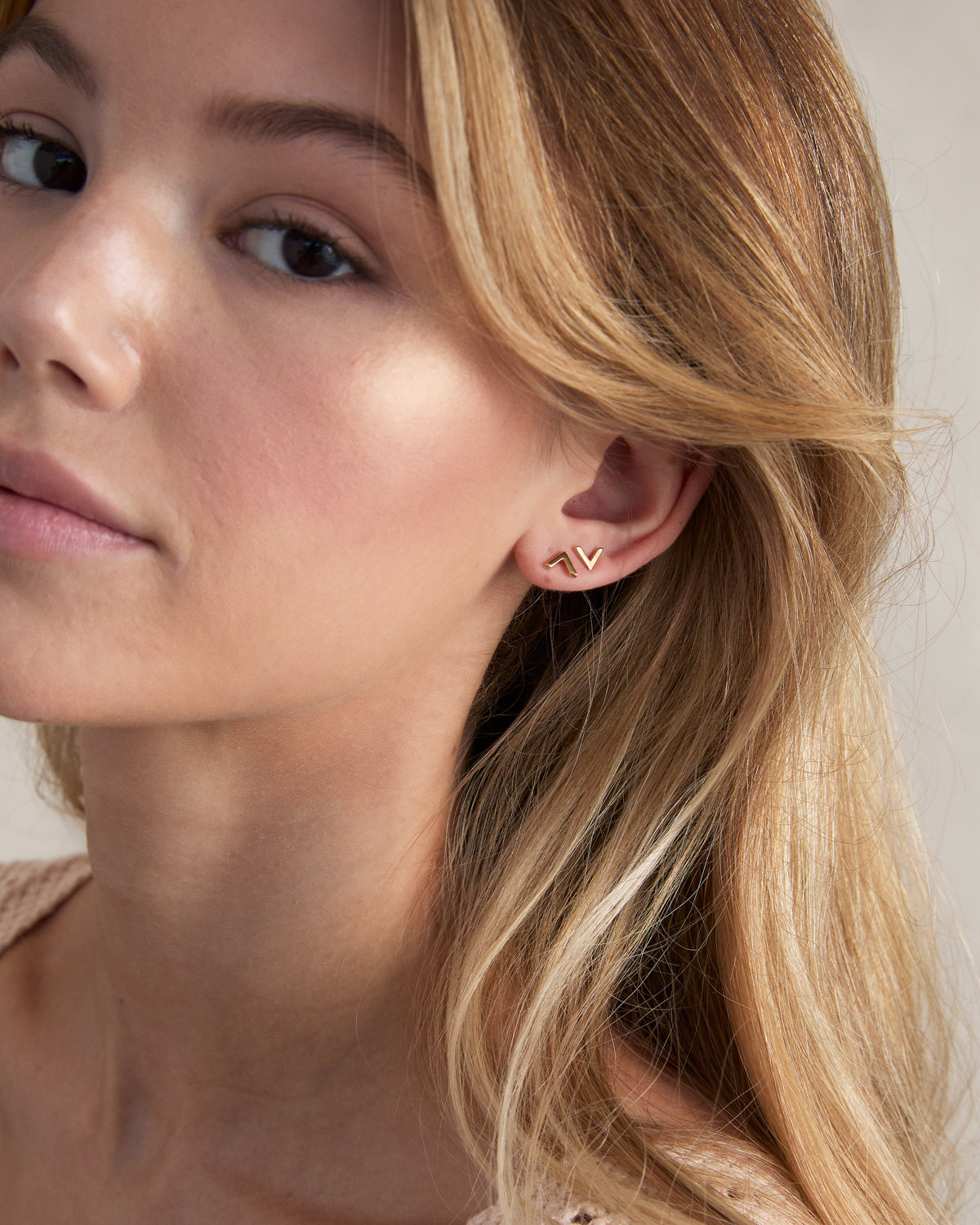 Model wearing Highs and Lows Stud Earrings