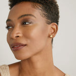 Model wearing Stars Can't Shine Without Darkness Earrings