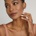 Model wearing Create Your Own Constellation Necklace in 14k gold finish