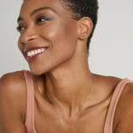 Model wearing Keep Dreaming Necklace in 14k gold finish