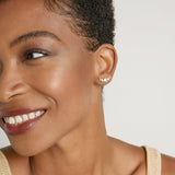 Model wearing Phases Earring Climbers in 14k gold finish