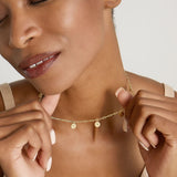 Model wearing Phases Choker in 14k gold finish