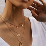 Bryan Anthonys Sun Will Rise Gold Necklace with crystals on model