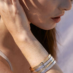Bryan Anthonys Sea Seeker Gold Hinged Bracelet with sea shell engravings on card