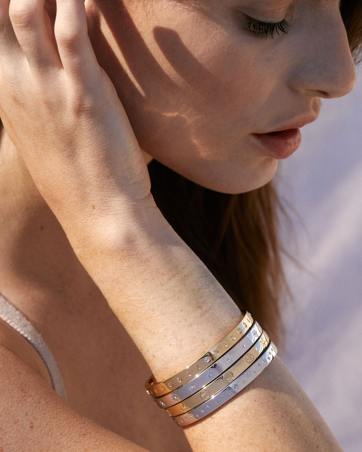 Bryan Anthonys Sea Seeker Gold Hinged Bracelet with sea shell engravings on card