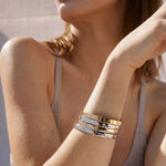 Bryan Anthonys Sea Seeker Gold Hinged Bracelet with sea shell engravings on card