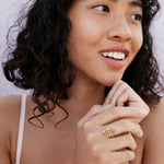 Overcome Ring in 14k gold finish on model