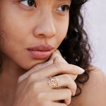 Overcome Ring in 14k gold finish on model