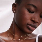 Model wearing Grit Necklace in 14k gold finish