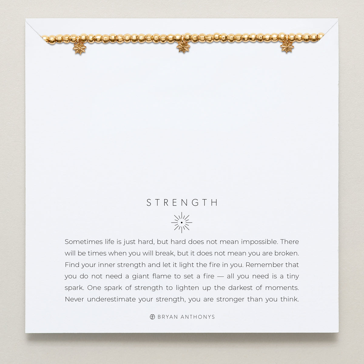 Close-up of Strength Beaded Icon Bracelet in 14k gold finish