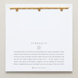Close-up of Strength Beaded Icon Bracelet in 14k gold finish