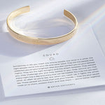 Squad Engraved Cuff showcase in 14k gold on card