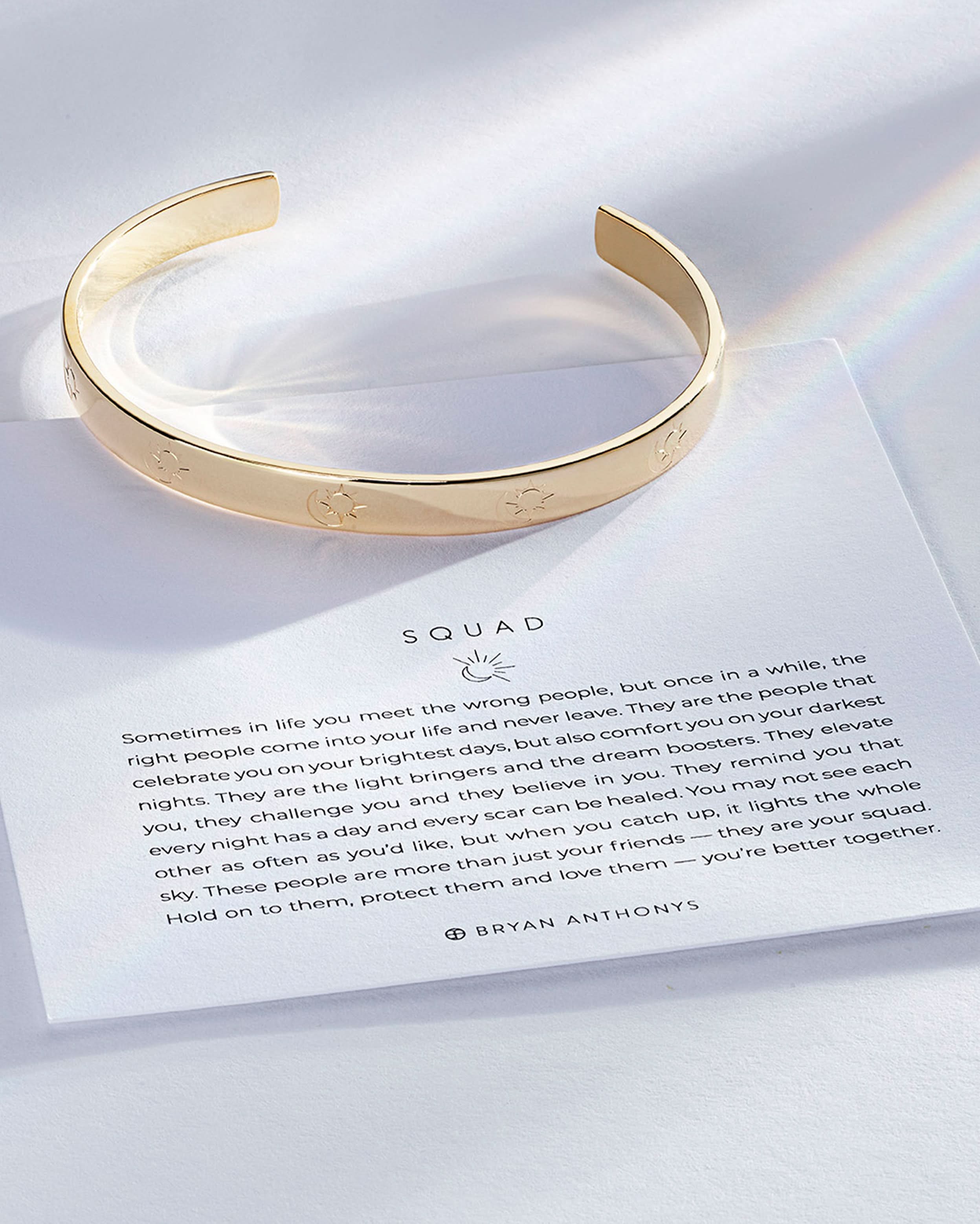 Squad Engraved Cuff showcase in 14k gold on card
