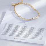 Grit Dainty Chain Bracelet showcase in 14k gold on card