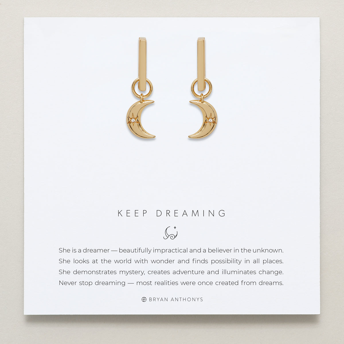 Close-up of Keep Dreaming Huggies in 14k gold finish