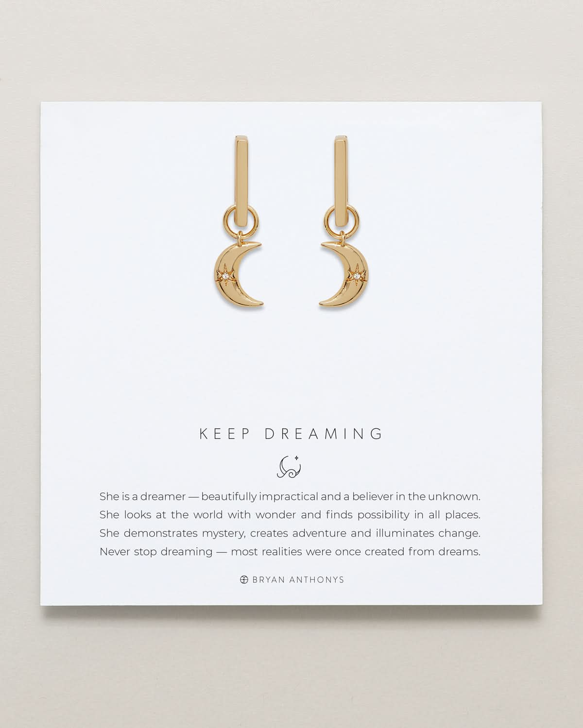Close-up of Keep Dreaming Huggies in 14k gold finish