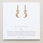Close-up of Keep Dreaming Huggies in 14k gold finish