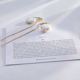 Grit Threader Earrings on card in 14k gold finish