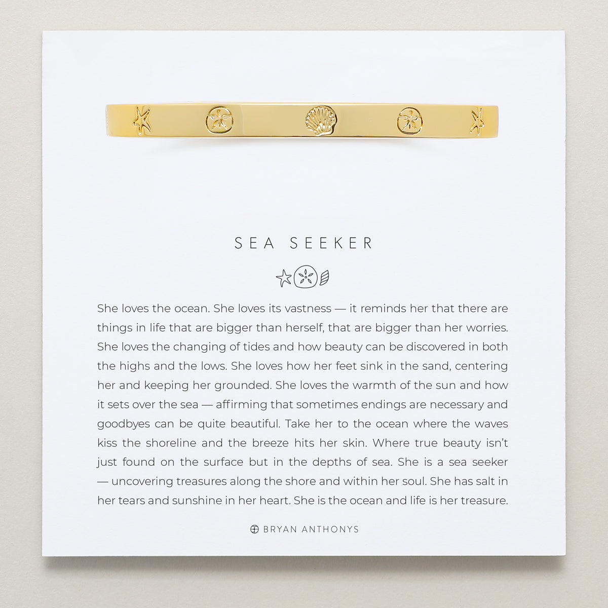 Bryan Anthonys Sea Seeker Gold Hinged Bracelet with sea shell engravings on card