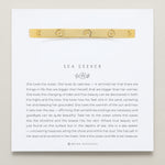 Bryan Anthonys Sea Seeker Gold Hinged Bracelet with sea shell engravings on card