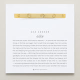 Bryan Anthonys Sea Seeker Gold Hinged Bracelet with sea shell engravings on card