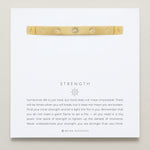 Bryan Anthonys Strength Gold Hinged Bracelet with Crystals on card