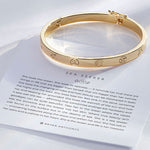 Sea Seeker Hinged Bracelet in 14k gold on card