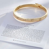 Sea Seeker Hinged Bracelet in 14k gold on card