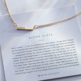 Blank Slate Necklace showcase in 14k gold on card