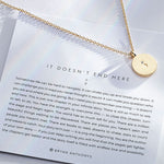 It Doesn't End Here Necklace showcase in 14k gold on card