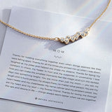 Mom Necklace showcase in 14k gold on card