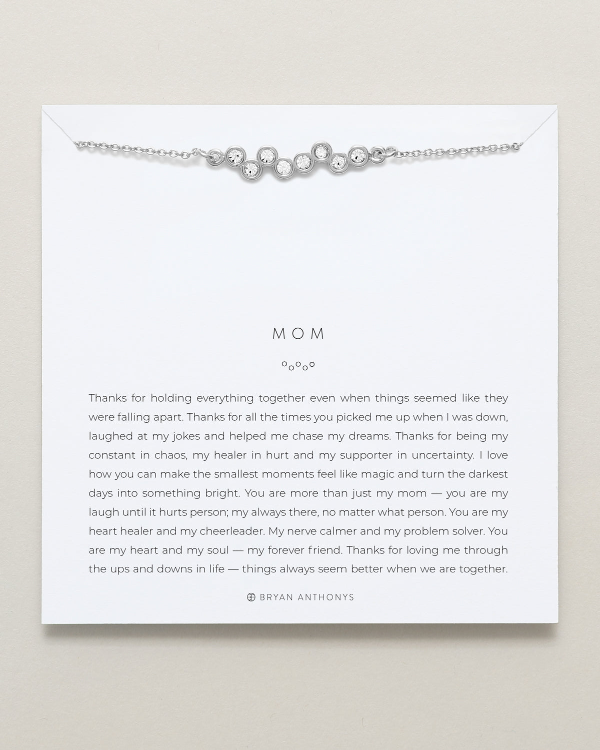 Model wearing Mom Necklace in silver finish