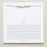 Model wearing Mom Necklace in silver finish