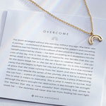 Overcome Necklace in 14k gold on card