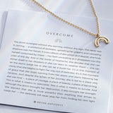 Overcome Necklace in 14k gold on card