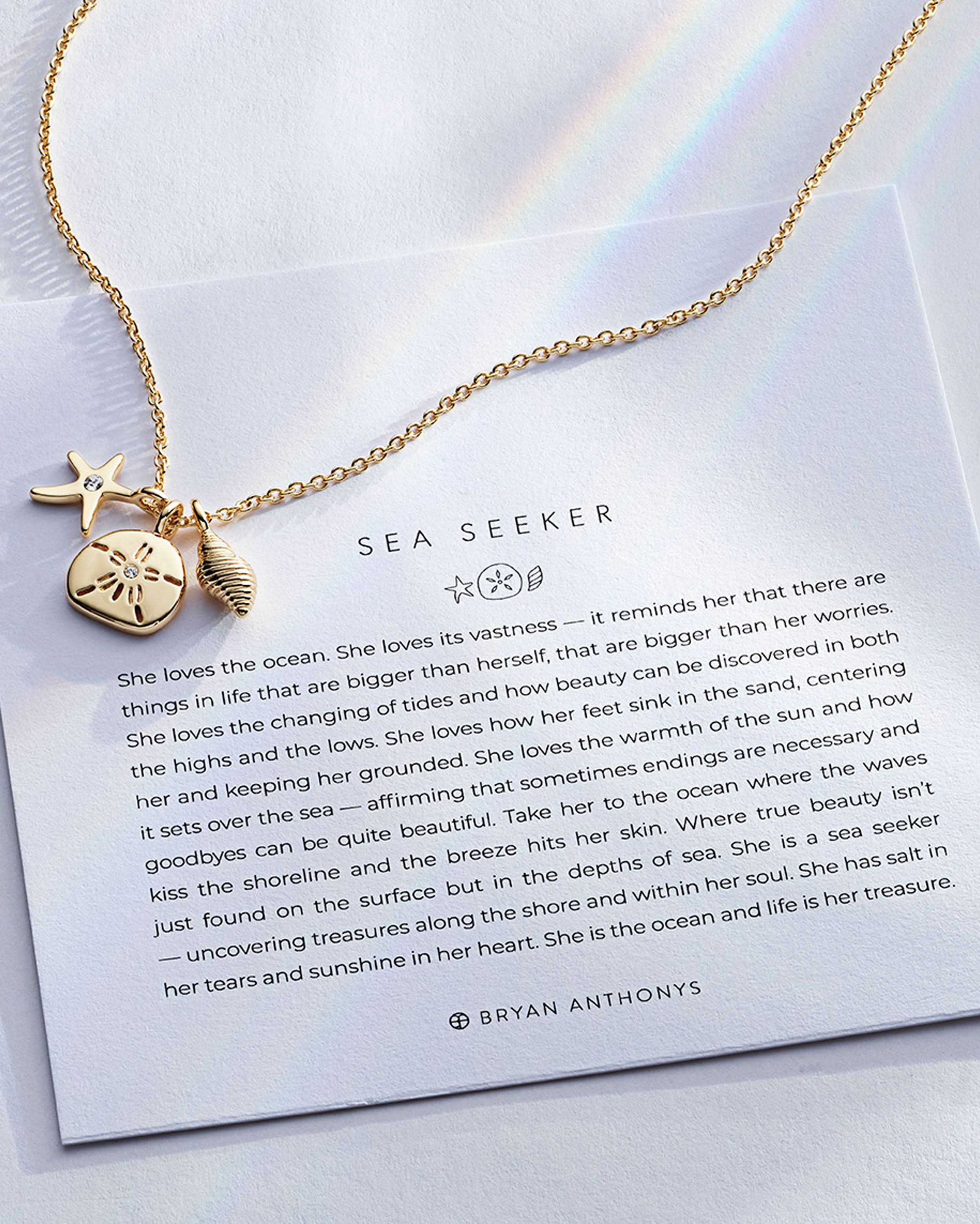 Sea Seeker Necklace showcase in 14k gold on card