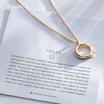 Squad Necklace showcase in 14k gold on card